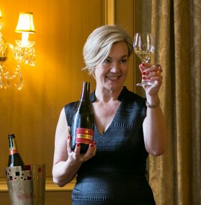 The Champagne Goddess, Susan Le Roux examining wine at wine tasting masterclass